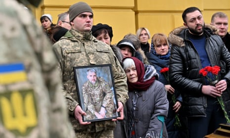 Relatives attend the funeral of Volodymyr Yezhov, a Ukrainian serviceman killed in fighting against Russian troops in Bakhmut, during a service at Volodymyr cathedral in Kyiv.