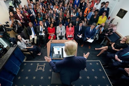 a man talks to a room full of people