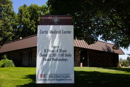 White sign in front of brown building