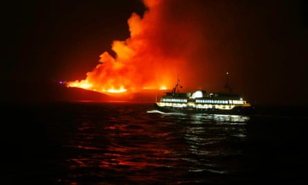A huge fire seen from the Manly Ferry service burns at North Head on Saturday night.