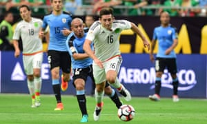 Mexico’s Hector Herrera gets away from Uruguay’s Egidio Arevalo Rios