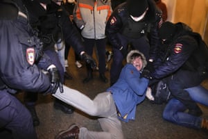 A demonstrator screams while being detained by police in St Petersburg.