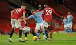 Kevin de Bruyne is crowded out by Fred, Aaron Wan-Bissaka and Scott McTominay.