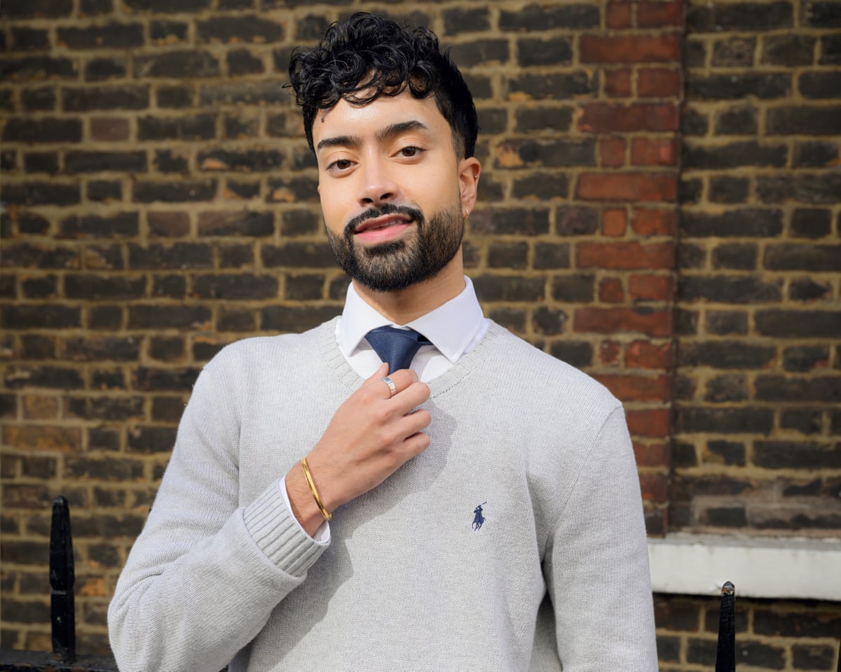 Chaand Singh wearing shirt and tie under a sweater
