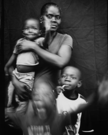Marie Mirlande Caceus, from Haiti, poses for a portrait with her sons, Miguel and Lilliam, and a family friend, three-year-old Ryan, in Tijuana, Mexico. Rendered homeless by Hurricane Matthew, Caceus migrated to Brazil and then the US-Mexico border. She and her husband have decided not to cross into the States for fear of being deported back to Haiti. Caceus, who speaks Creole, is slowly learning Spanish, recently adding ‘amigo’, ‘hola’ and ‘arroz’ to her vocabulary