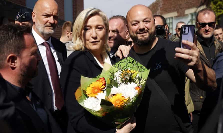 Marine Le Pen meets supporters after casting her ballot in Henin-Beaumont on Sunday.