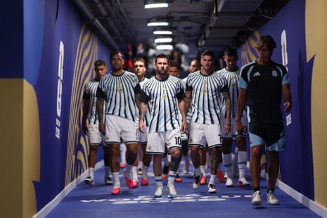Messi leads his teammates out