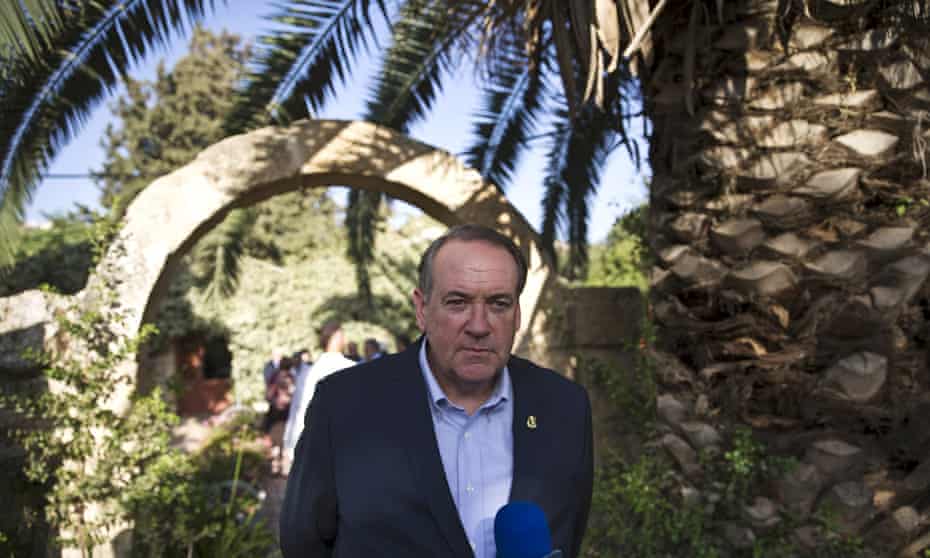 Republican presidential candidate Mike Huckabee attends a news conference near the West Bank Jewish settlement of Shiloh.