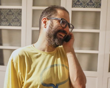 Abd el-Fattah smiles while he receives a phone call.