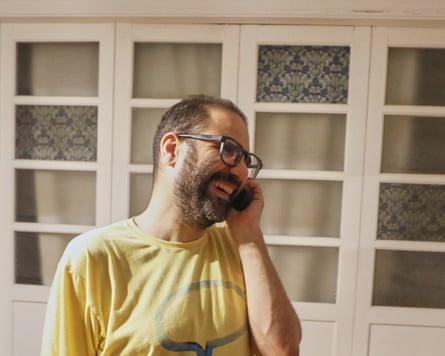 Alaa Abd el-Fattah smiling on a phone call