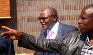 Tendai Biti, centre, leaves Zimbabwe’s high court in Harare