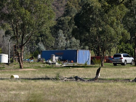 A blue shipping container is seen where Victoria Police officers attended a scene where fugitive Dezi Freeman was shot dead