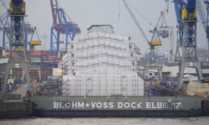 The luxury yacht Dilbar lies completely covered in the Blohm+Voss dock Elbe 17 in Hamburg, Germany.