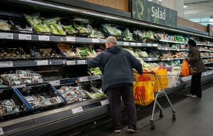 Shoppers in the fruit and vegetables section of a branch of Sainsbury's in south London. Shoppers are said to be buying a range of Christmas items, such as presents and frozen turkeys, early 