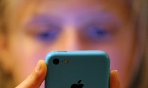 Teenage girl looking at a smartphone