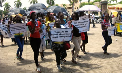 Demonstrators protest in front of the Presidential Palace in Santo Domingo on 26 May 2015 calling for the restoration of their Dominican nationality. 