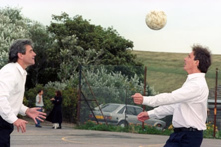 Labour leader Tony Blair takes part in a heading contest with Newcastle United boss Kevin Keegan in Brighton during a break at the 1995 party conference