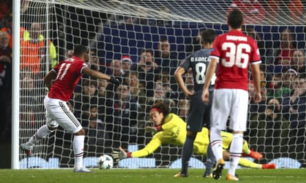 Benfica’s Mile Svilar saves a penalty from Anthony Martial in the Champions League Group A match.