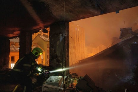 A firefighter working in a damaged building