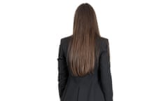 Elegant woman in business black suit walking away
