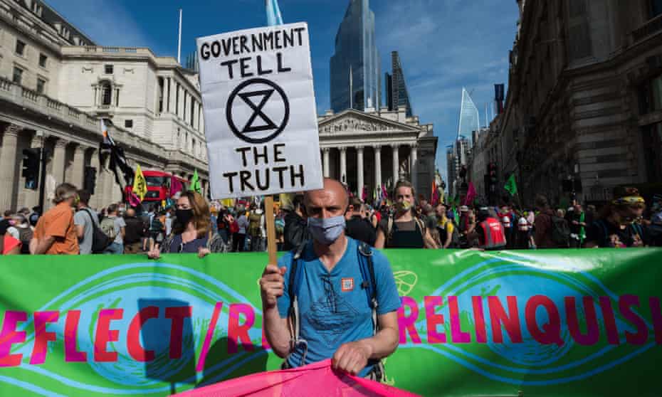 : Activists from Extinction Rebellion gather by the Bank of England ahead of marching through central London on the tenth and final day of mass protest action, on 10 September.