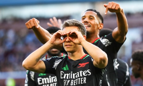 Leandro Trossard of Arsenal celebrates their first goal with his teammates at Aston Villa.