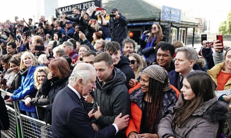 King Charles III meets members of the queue along the South Bank, near Lambeth Bridge, London.