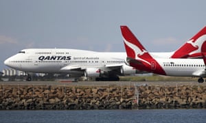 Two Qantas flights arriving at Sydney airport. The government has banned direct travel from China until 29 February.