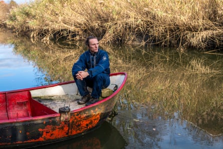 Paul Powlesland on his rowing boat on the River Roding.
