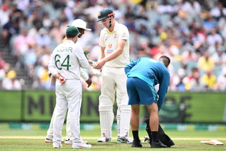 Cameron Green has his injured finger tended to by a physio.