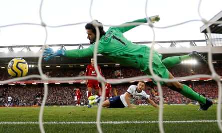 Harry Kane watches his header creep past Alisson to give Tottenham an early lead.