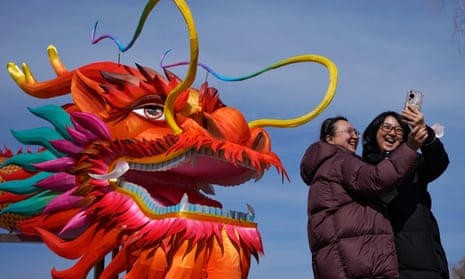 A giant dragon lantern greets tourists near the frozen Houhai lake in Beijing.