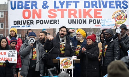 Rideshare drivers protest outside LaGuardia airport on 26 February over their treatment and pay by Uber and Lyft.