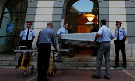 Workers carry a coffin