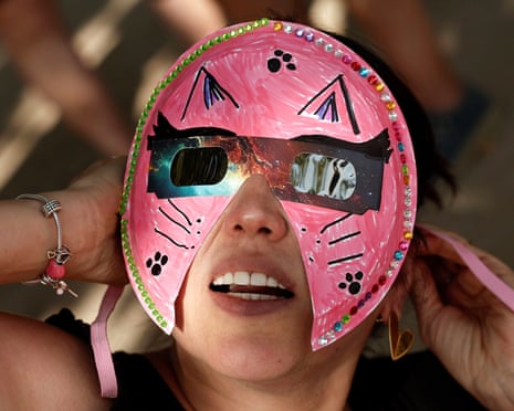 An enthusiast wears a pair of protective eclipse viewing glasses while awaiting the solar eclipse at the Temple of Debod in Madrid, Spain.