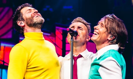 Howard Donald, Gary Barlow and Mark Owen of Take That performing at the O2 Arena.