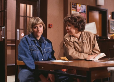 TV still of Anne Reid in a beige coat and Victoria Wood in a denim jacket sitting at a table