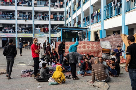 Palestinians and their families take shelter in an UNRWA school in Rafah.