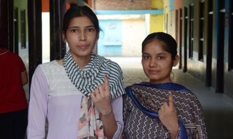 Young Indian voters show their ink-marked fingers after voting during the seventh and last phase of the Indian parliament elections at a polling station on the outskirts of Amritsar, Punjab, India, 1 June 2024.