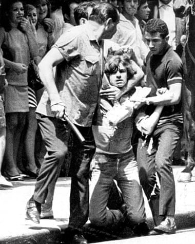 Unidentified men detain a student during a protest in São Paulo on 9 October 1968, during the military dictatorship.