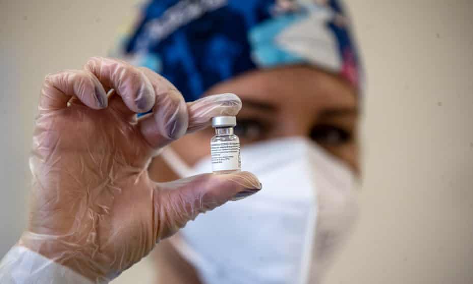 A nurse holds a Covid vaccine in Rome, Italy