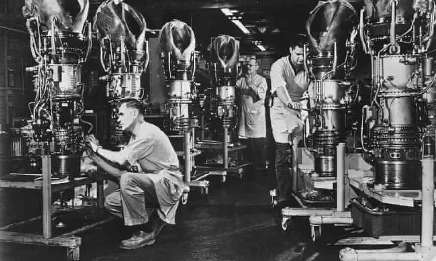 Production Line12th August 1968: Mechanics putting the finishing touches to six T58 turboshaft engines at the General Electric Company at Schenectady, New York. The engines are designed for use in helicopters and range in capacity to up to 1,500 horsepower. (Photo by Alan Band/Fox Photos/Getty Images)