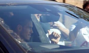 Gareth Bale waves to fans as he arrives in Enfield.
