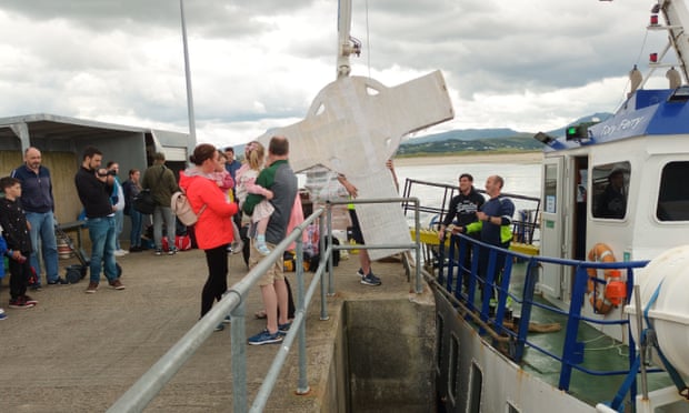 A part of the cross is loaded on to a ferry.