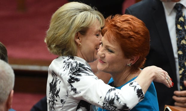 Government minister, Michaelia Cash, (left) hugs Pauline Hanson after Hanson’s maiden speech in the Senate.