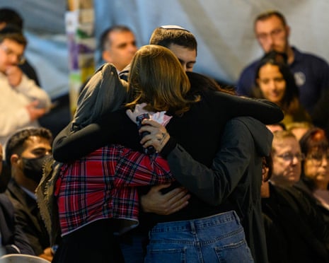 The siblings and sister-in-law of Daniel Peretz embrace during his funeral. Peretz was an Israeli soldier who was captured on 7 October 2023 and whose remains were returned to Israel this week, at Mount Herzl National Cemetery on 15 October 2025 in Jerusalem.