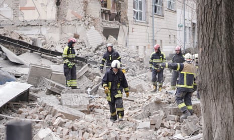 Rescuers work after a missile attack in Pecherskyi district, Kyiv, on Monday.