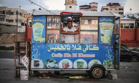 Issa Hassan, 22, in his a beachside coffee stall in Gaza.