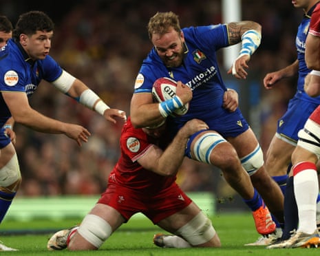 italy’s Niccolo Cannone is tackled.