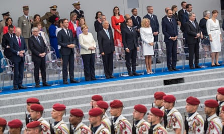 The Bastille Day parade in Paris watched by European leaders including Angela Merkel.